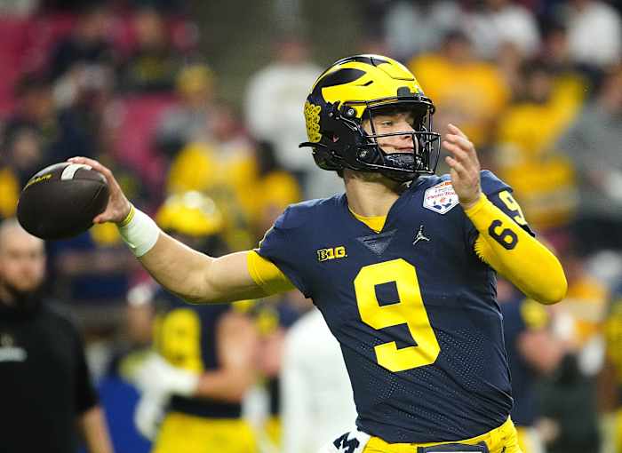 December 31, 2022; Glendale, Ariz; USA; Michigan quarterback JJ McCarthy (9) throws a pass during the pregame before the Fiesta Bowl at State Farm Stadium. Ncaa Fiesta Bowl Game